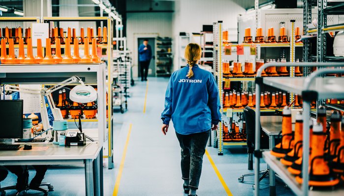 Jotron employee walking through the production department.