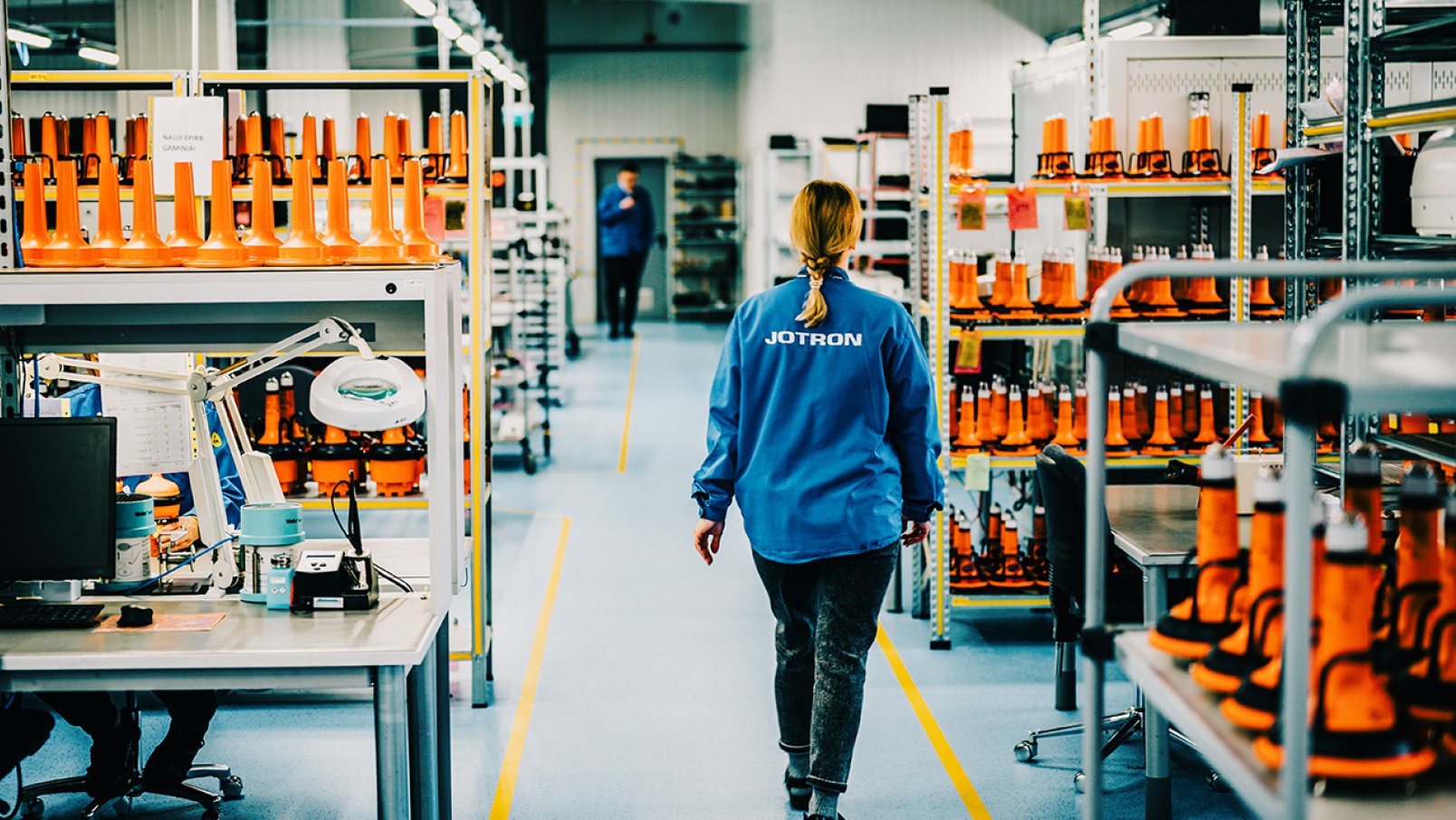 Jotron employee walking through the production department.