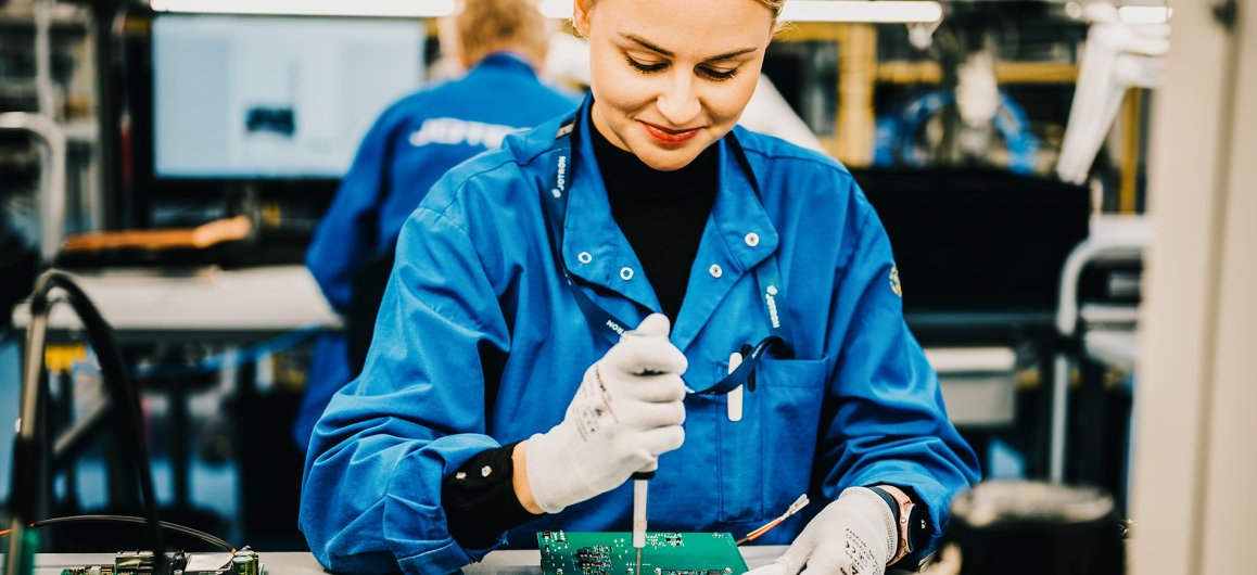A Jotron employee working the production.