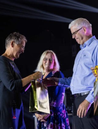 Jotron employees receiving rewards at an internal event. Jotron employees receiving rewards at an internal event.