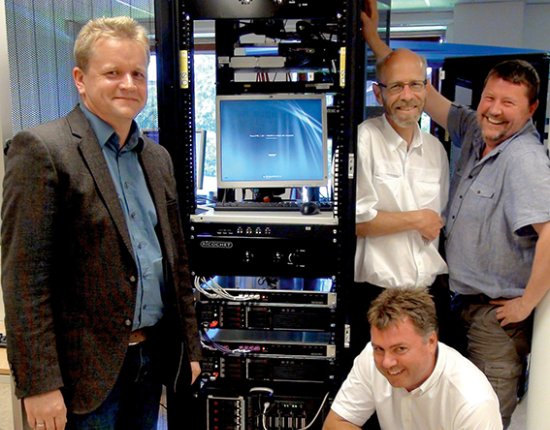 Four Jotron employees in front of a Ricochet recorder rack. Four Jotron employees in front of a Ricochet recorder rack.