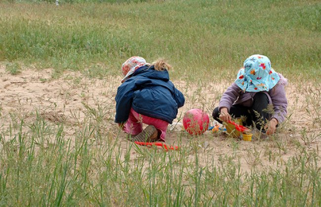 Two children playing outdoors. Two children playing outdoors.