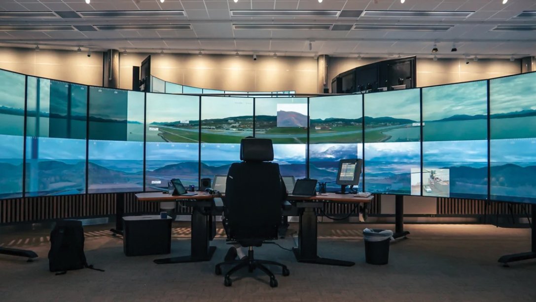 Person in front of monitors, operating in a ATC remote tower. 