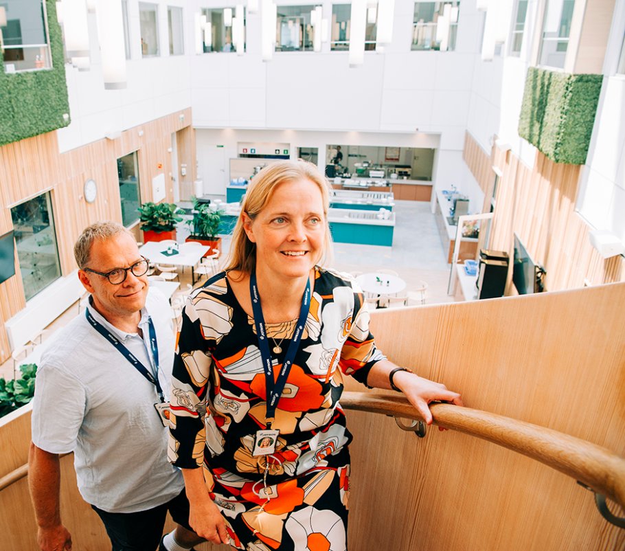 Employees climbing the spiral staircase at Jotron.