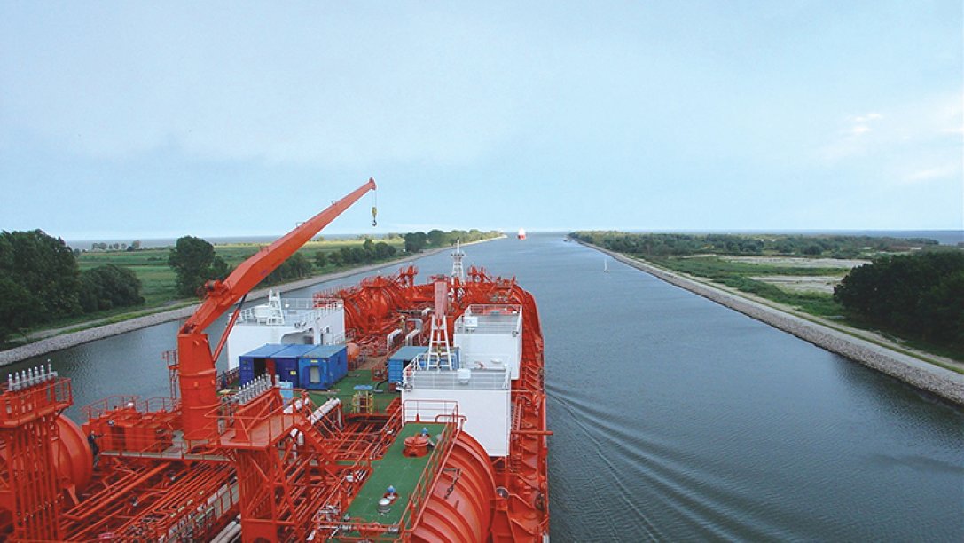 Two large vessels on an inland waterway.