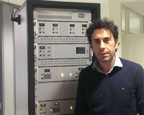 Nenad Jankovic in front of Jotron's radio rack.