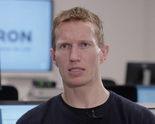 Jotron employee explaining about testing and certifying Jotron products.