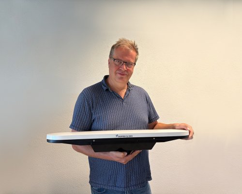 Paul Connelly Technical Director at Jotron holding the SKIPPER SL1300 antenna.