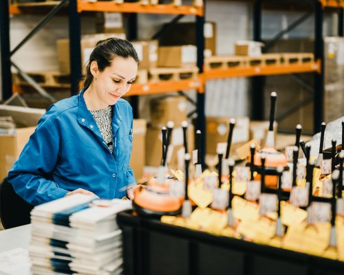 Jotron employee working in the production of EPIRBs.