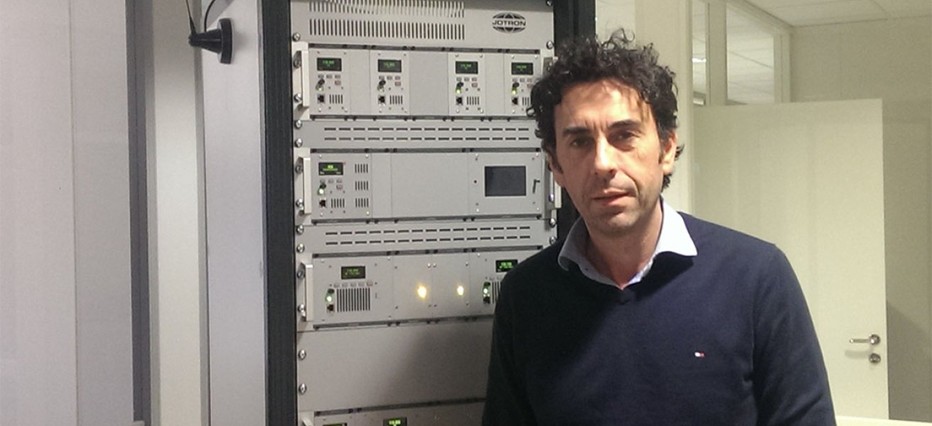 Nenad Jankovic in front of Jotron's radio rack.