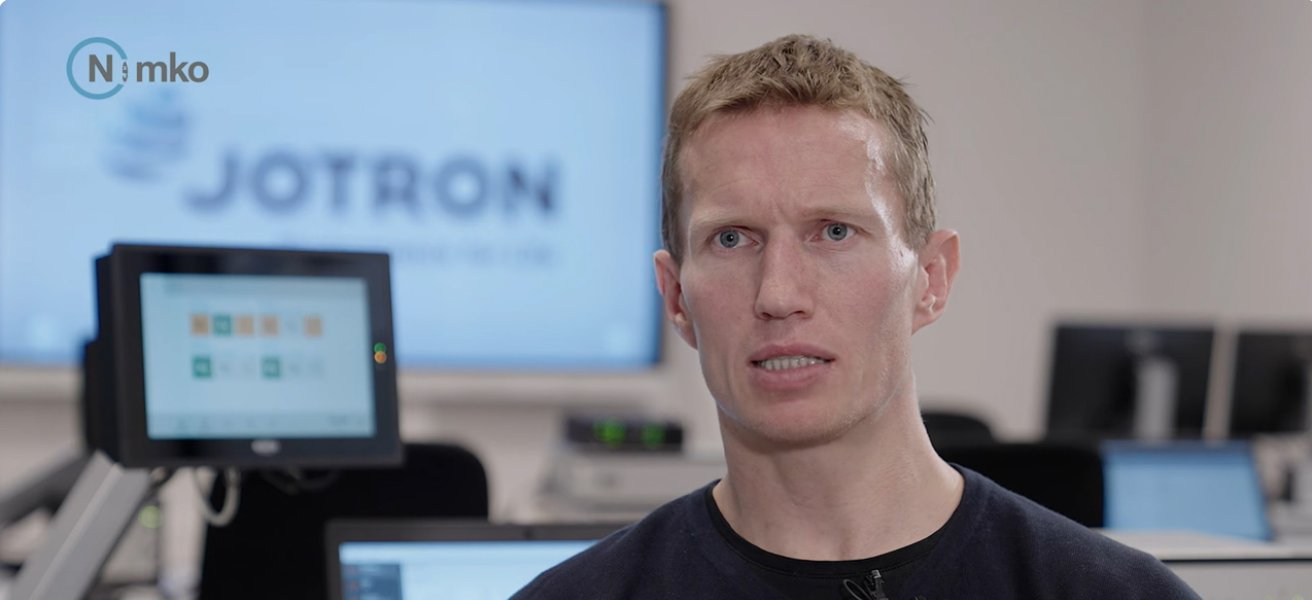 Jotron employee explaining about testing and certifying Jotron products.