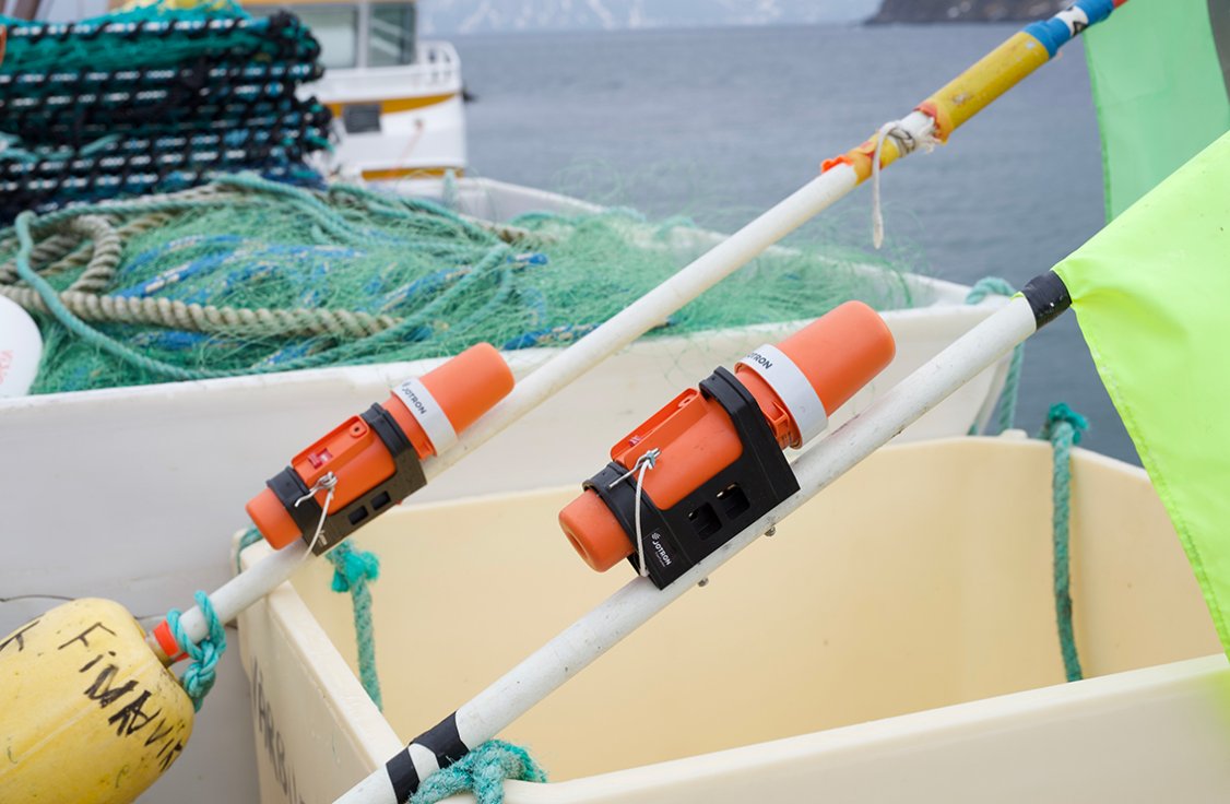 Two TronTrackers laying in the boat.