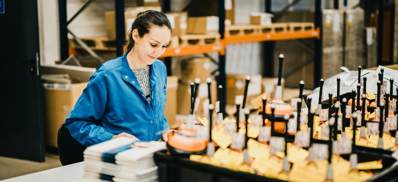 Jotron employee working in the production of EPIRBs.