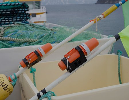 Two TronTrackers laying in the boat.