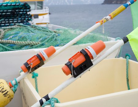 Two TronTrackers laying in the boat. Two TronTrackers laying in the boat.