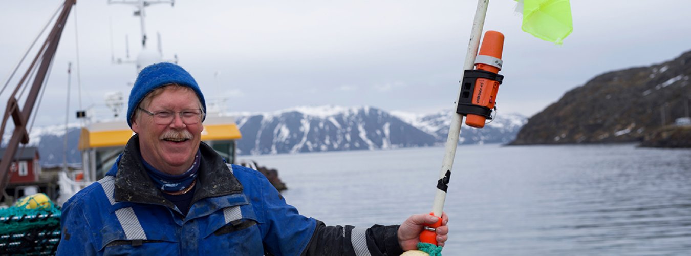 Fisherman holding TronTracker. Fisherman holding TronTracker.