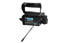 TR-910 Man Portable Radio with antenna, placed in a carry bag.