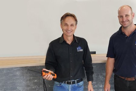 Francois du Toit from Radio Electronic Namibia holding EPIRBs.