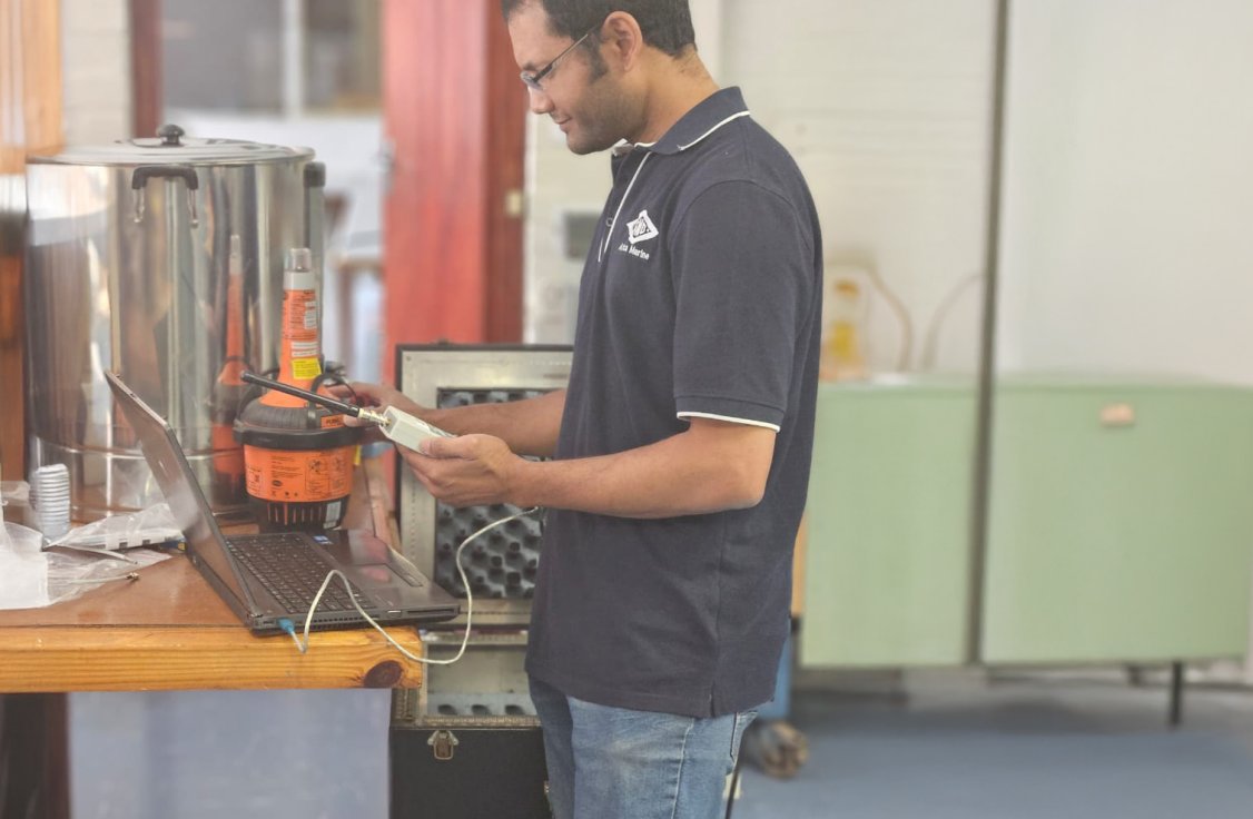 SMD technician doing SBM on a Tron 40 VDR AIS.