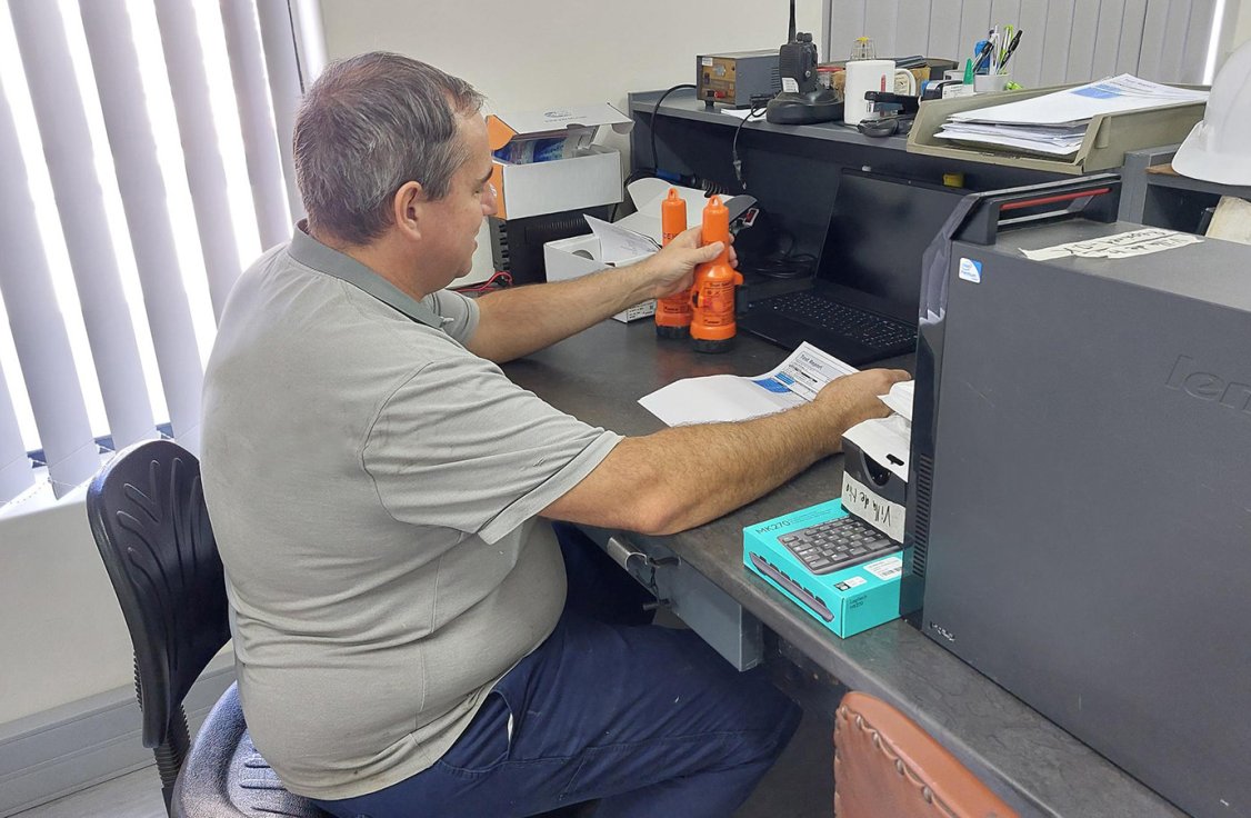 An employee at Radio Electronic is reading a test report.