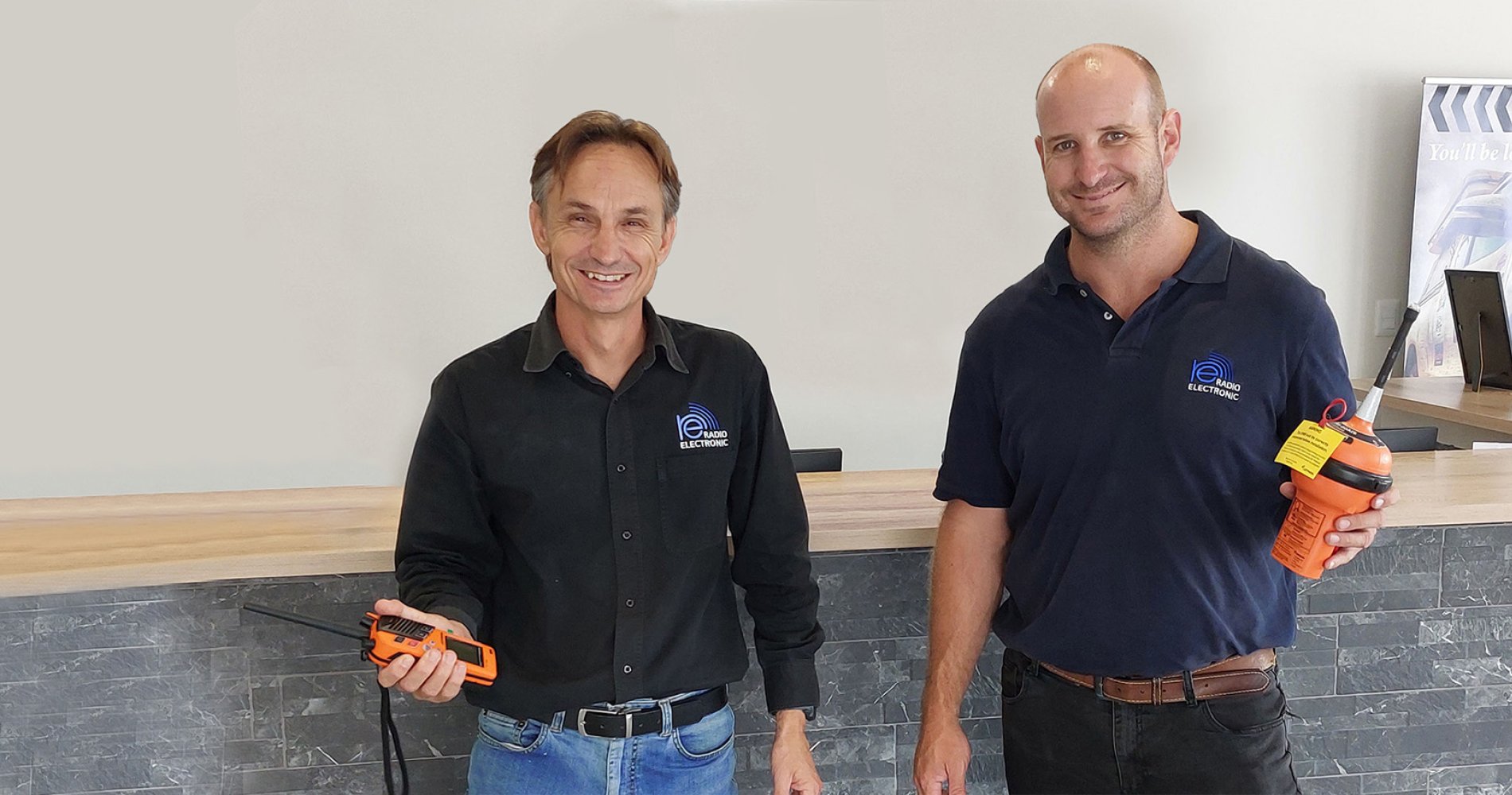 Francois du Toit from Radio Electronic Namibia holding EPIRBs.