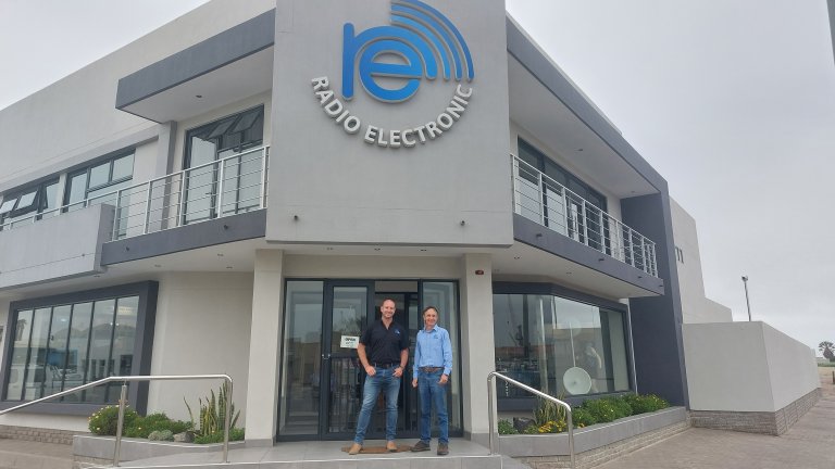 Radio Electronic, in front of office.