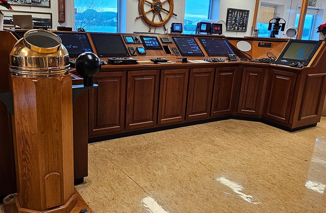 Inside the Vico building at Avaldsnes, showing a vessel bridge with navigation equipment.