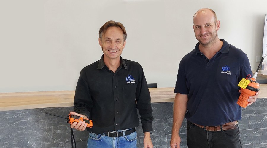 Francois du Toit from Radio Electronic Namibia holding EPIRBs. Francois du Toit from Radio Electronic Namibia holding EPIRBs.